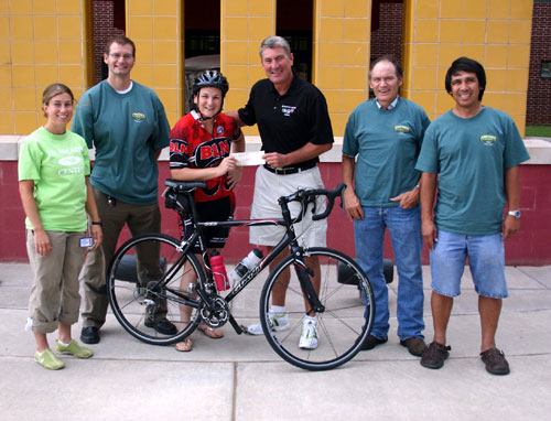 Presenting a check to Uwe von Schamann (center), director of development for the McCarty Center, are Norman Conquest committee members (l-r) Michelle Carr, Ken Kehoe, Corri Ide, von Schamann, Dave Ferguson and Rick Gutierrez.