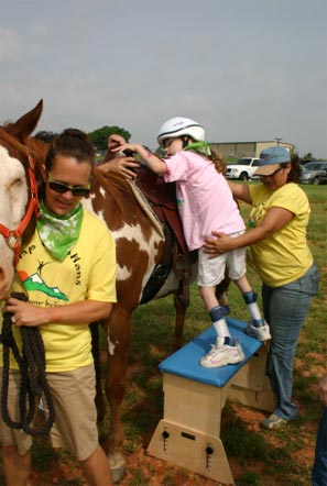 Camper Ginney Webb, of Purcell, gets ready to ride.